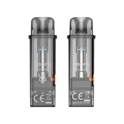 Two transparent smoky gray vape pods side by side on a plain white background, showing internal components and printed markings including CE and MADE IN CHINA.